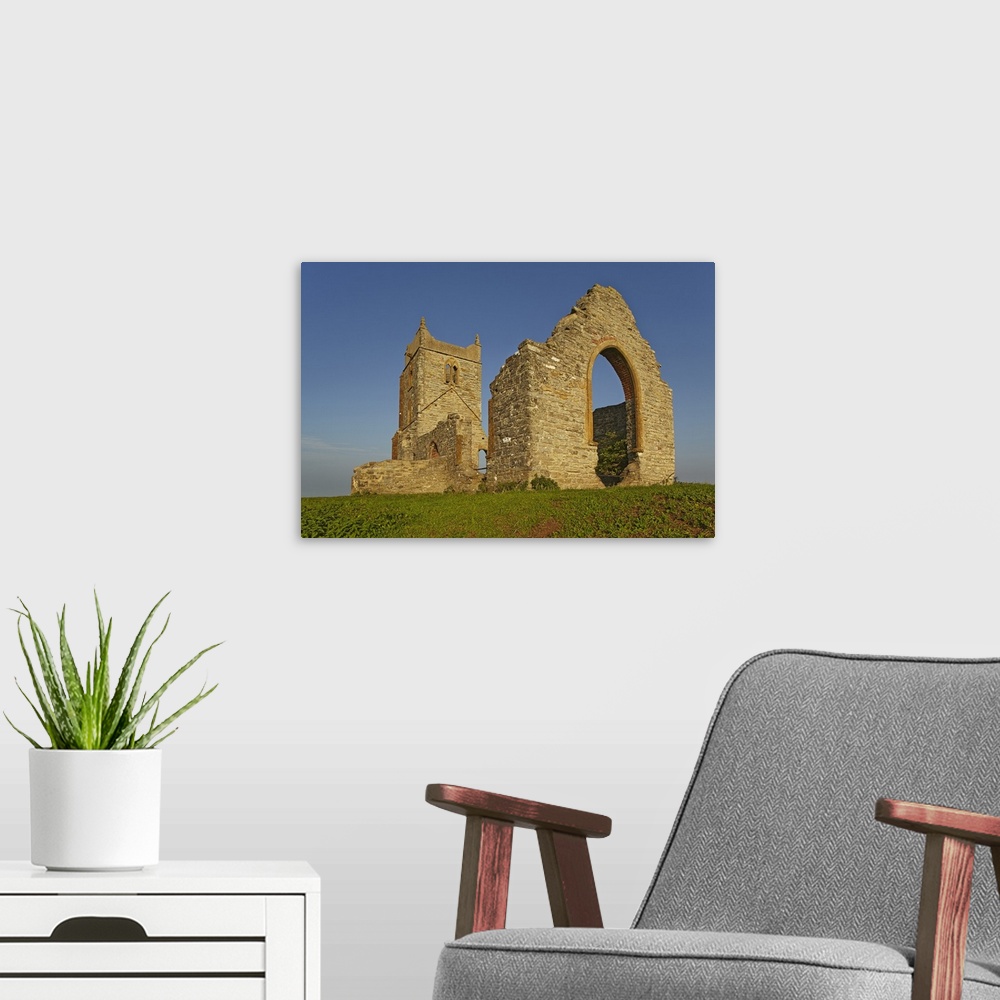 A modern room featuring The ruins of St. Michael's Church on the summit of Burrow Mump, a small hill at Burrowbridge, in ...