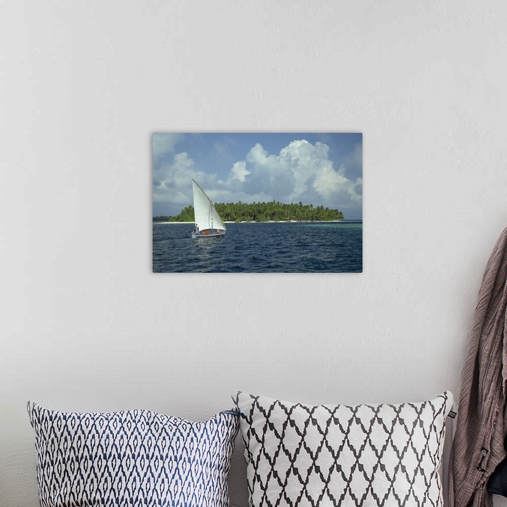 A bohemian room featuring Sailing boat off a tropical island in the Maldive Islands, Indian Ocean, Asia