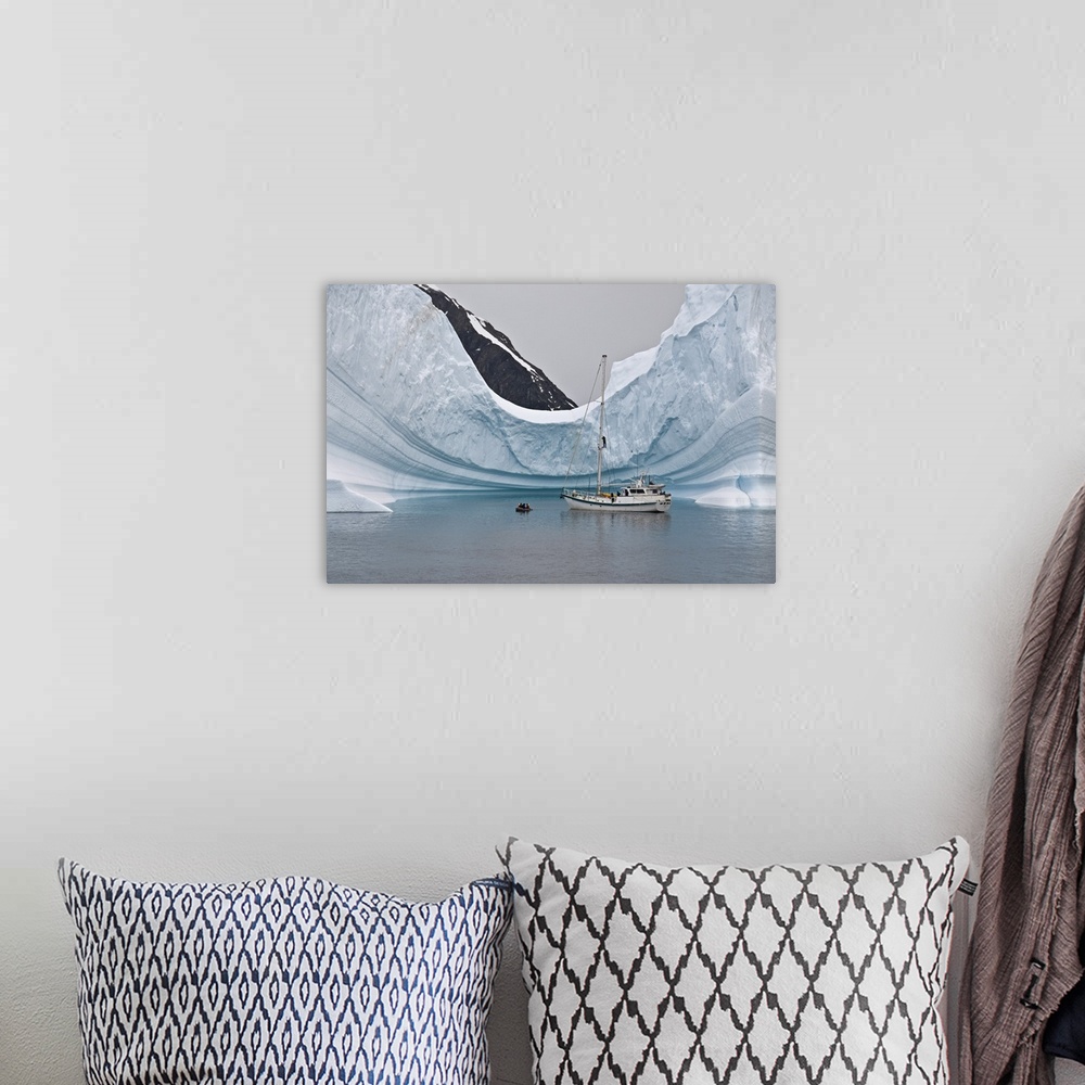 A bohemian room featuring Sailing yacht and iceberg, Errera Channel, Antarctica