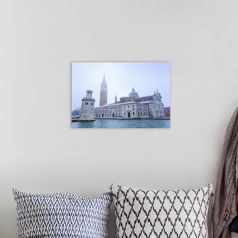 A bohemian room featuring San Giorgio Maggiore in the mist on a cold winter morning after snow, Venice, Veneto, Italy