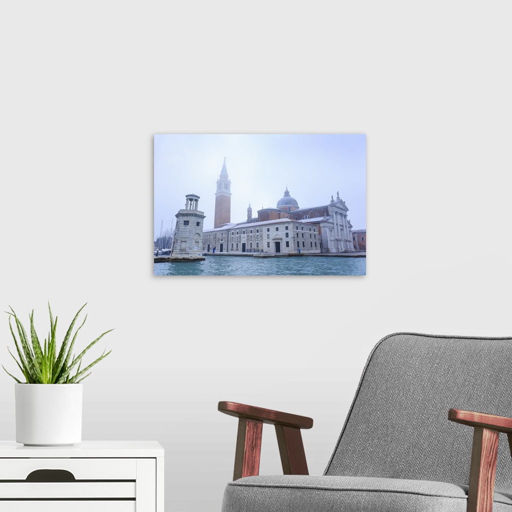 A modern room featuring San Giorgio Maggiore in the mist on a cold winter morning after snow, Venice, Veneto, Italy