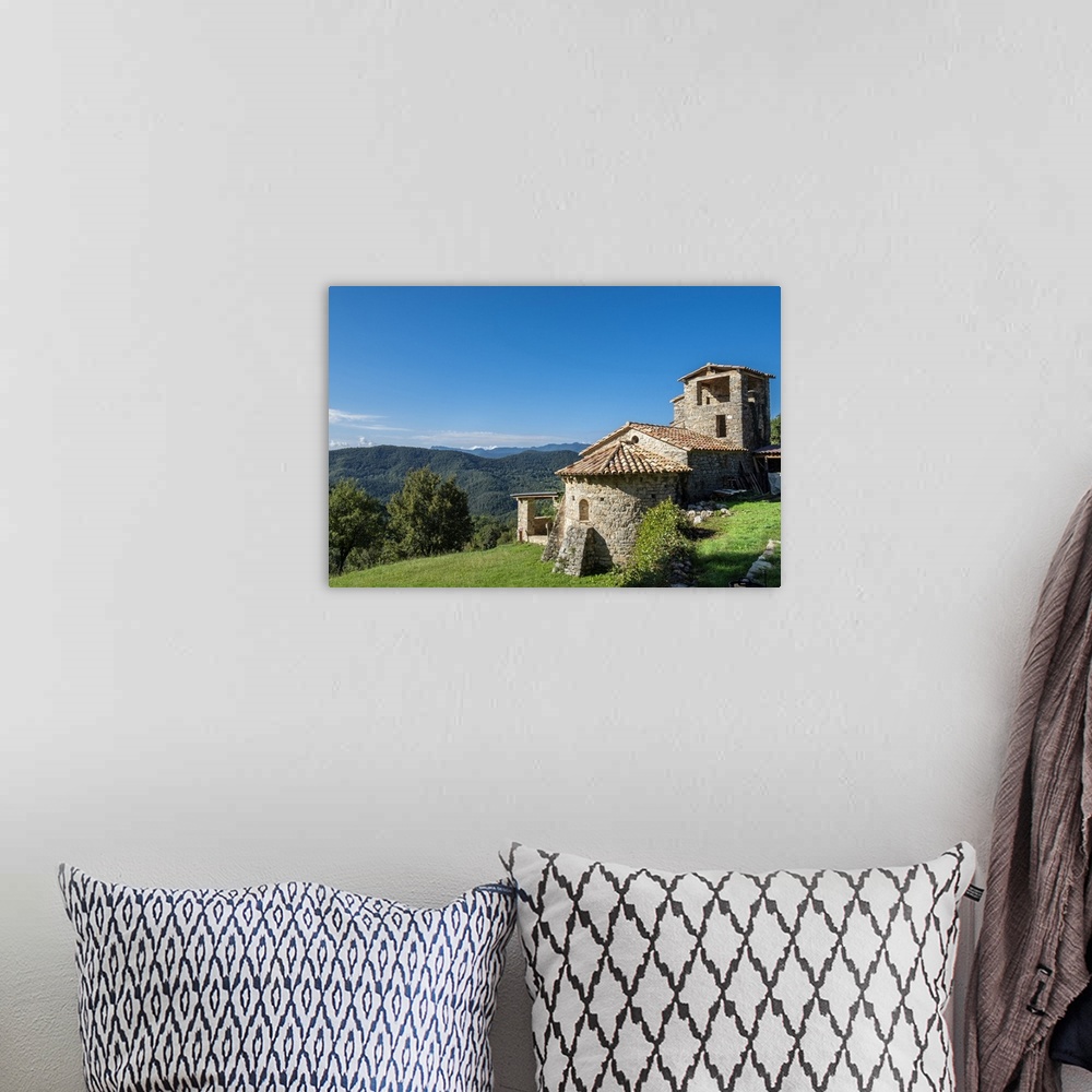 A bohemian room featuring Sant Marti de Toralles Norman church and the Garrotxa Volcanic Zone Natural Park, Pyrenees, Catal...