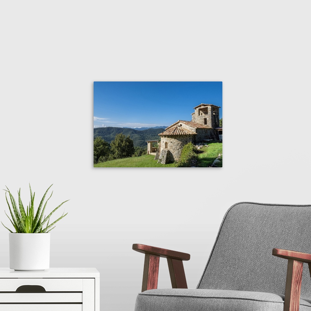 A modern room featuring Sant Marti de Toralles Norman church and the Garrotxa Volcanic Zone Natural Park, Pyrenees, Catal...