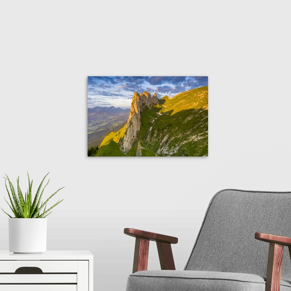 A modern room featuring Sunrise on rocky peak of Saxer Lucke mountain in summer, Appenzell Canton, Alpstein Range, Switze...