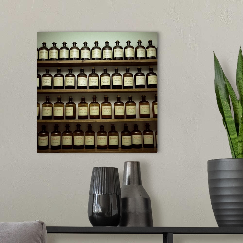 A modern room featuring Shelves of old essence bottles, Parfumerie Fragonard, Grasse, Provence, France