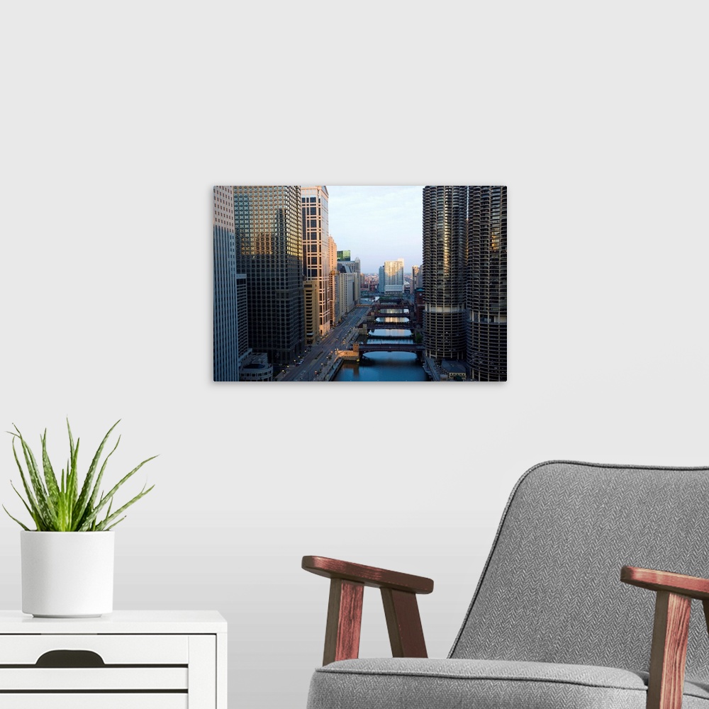 A modern room featuring Skyscrapers along the Chicago River and West Wacker Drive at dawn, Marina City on the right, Chic...