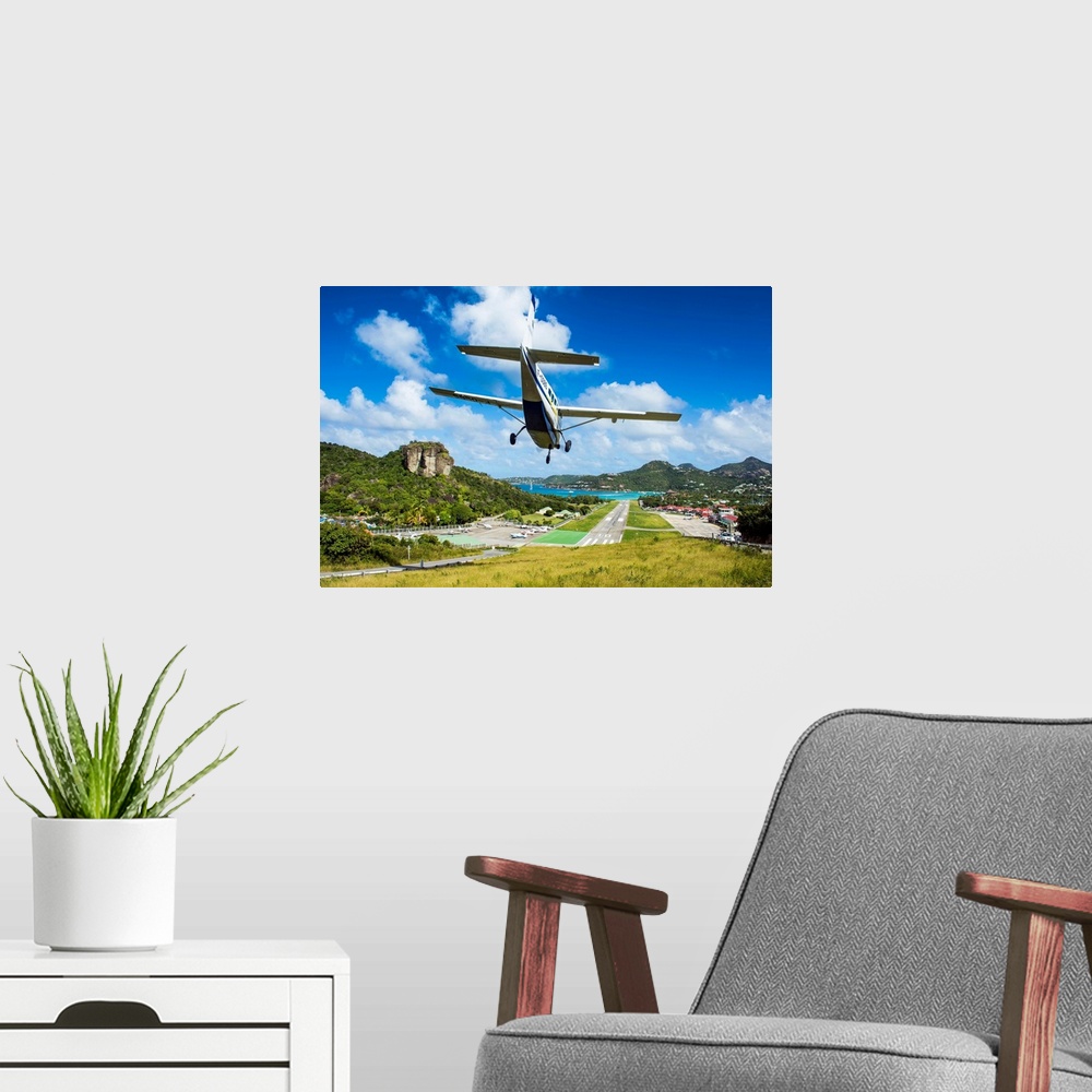 A modern room featuring Small airplane landing at the airport of St. Barth, Lesser Antilles, West Indies, Caribbean