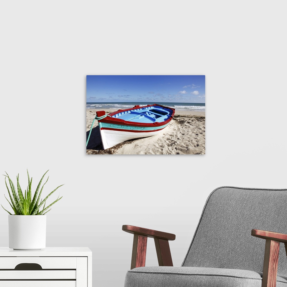 A modern room featuring Small  boat on tourist beach the Mediterranean Sea, Djerba Island, Tunisia