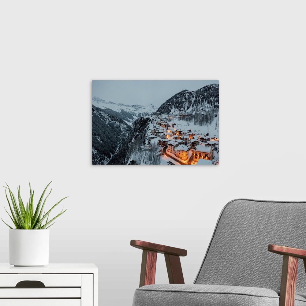 A modern room featuring Small village of Pianazzo on top of snowcapped mountain after a snowfall, Madesimo, Valle Spluga,...