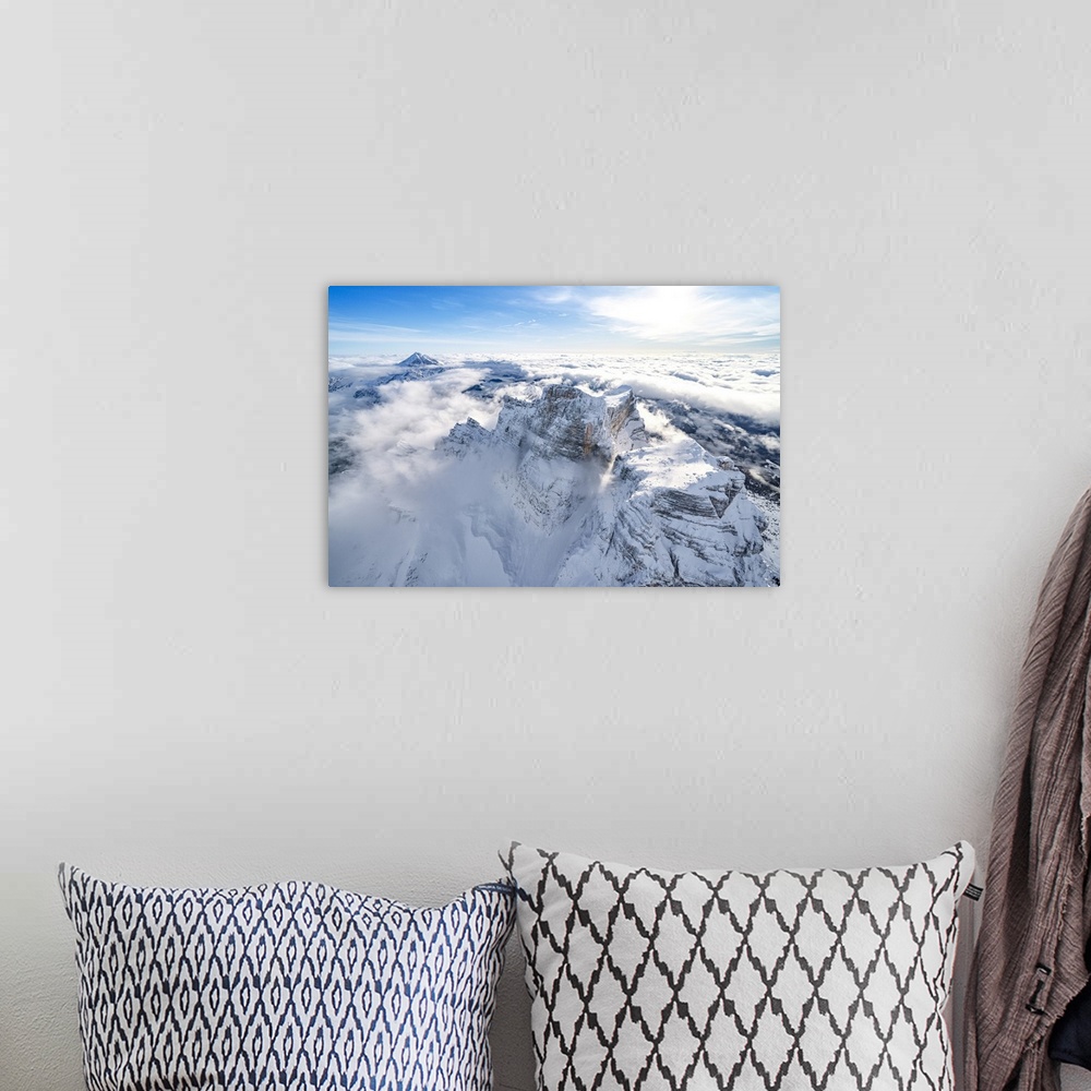 A bohemian room featuring Snow capped Monte Pelmo emerging from clouds, aerial view, Dolomites, Belluno province, Veneto, I...
