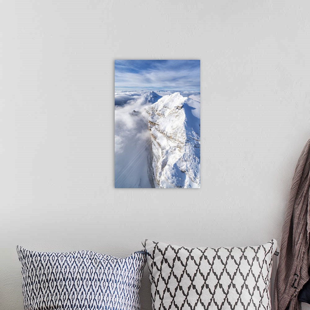 A bohemian room featuring Aerial view of snow capped Tofane group and scenic Freccia nel Cielo cableway, Dolomites, Belluno...