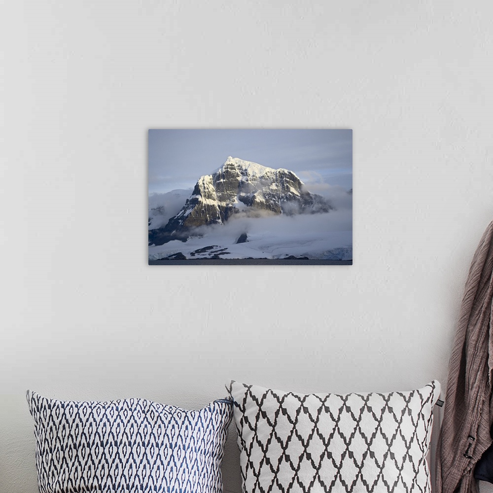 A bohemian room featuring Snow covered coastal mountain, Wiencke Island, Antarctica