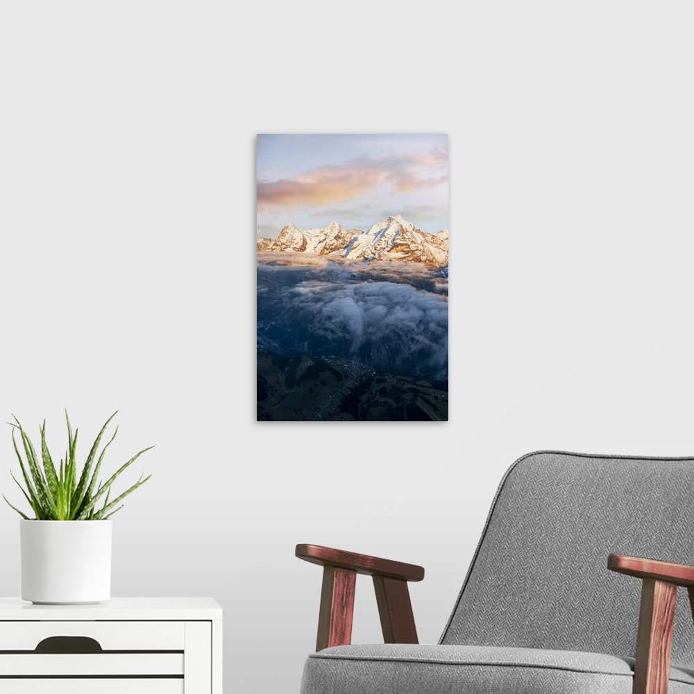 A modern room featuring Aerial view of snowcapped peaks of Eiger, Monch and Jungfrau in fog at sunset, Murren Birg, Jungf...