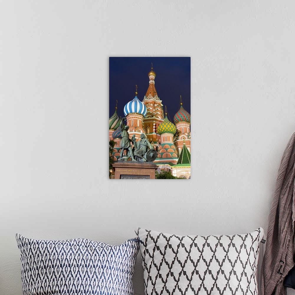 A bohemian room featuring St. Basil's Cathedral and the statue of Kuzma Minin and Dmitry Posharsky lit up at night, Moscow,...