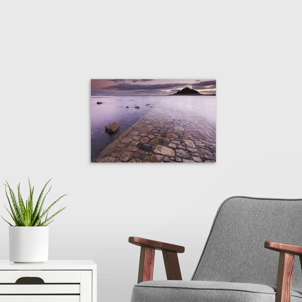 A modern room featuring A dusk view of St. Michael's Mount, one of Cornwall's most iconic landmarks, in Marazion, near Pe...