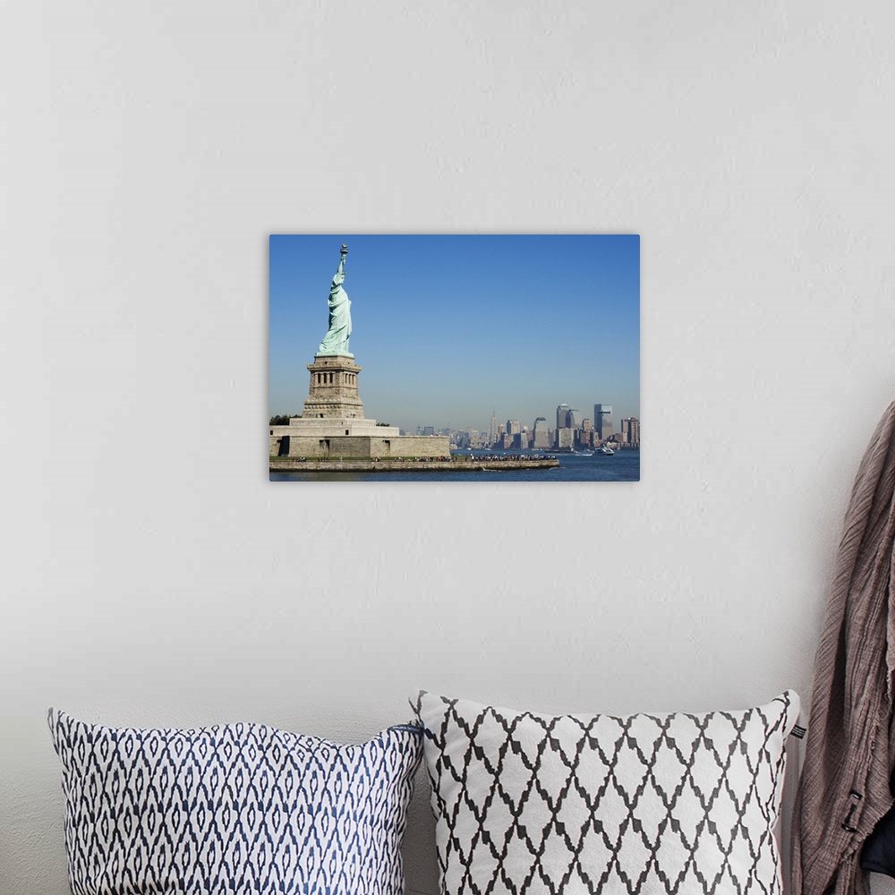 A bohemian room featuring Statue of Liberty, Liberty Island and Manhattan skyline beyond, New York City, New York