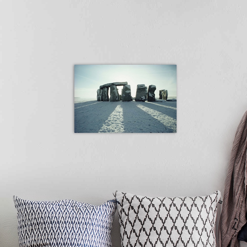 A bohemian room featuring Stonehenge, in winter snow, Wiltshire, England