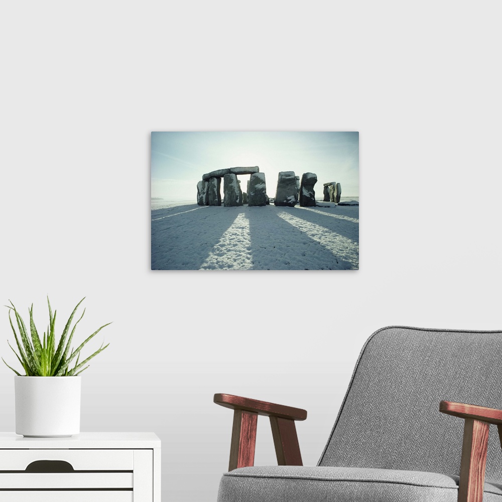 A modern room featuring Stonehenge, in winter snow, Wiltshire, England