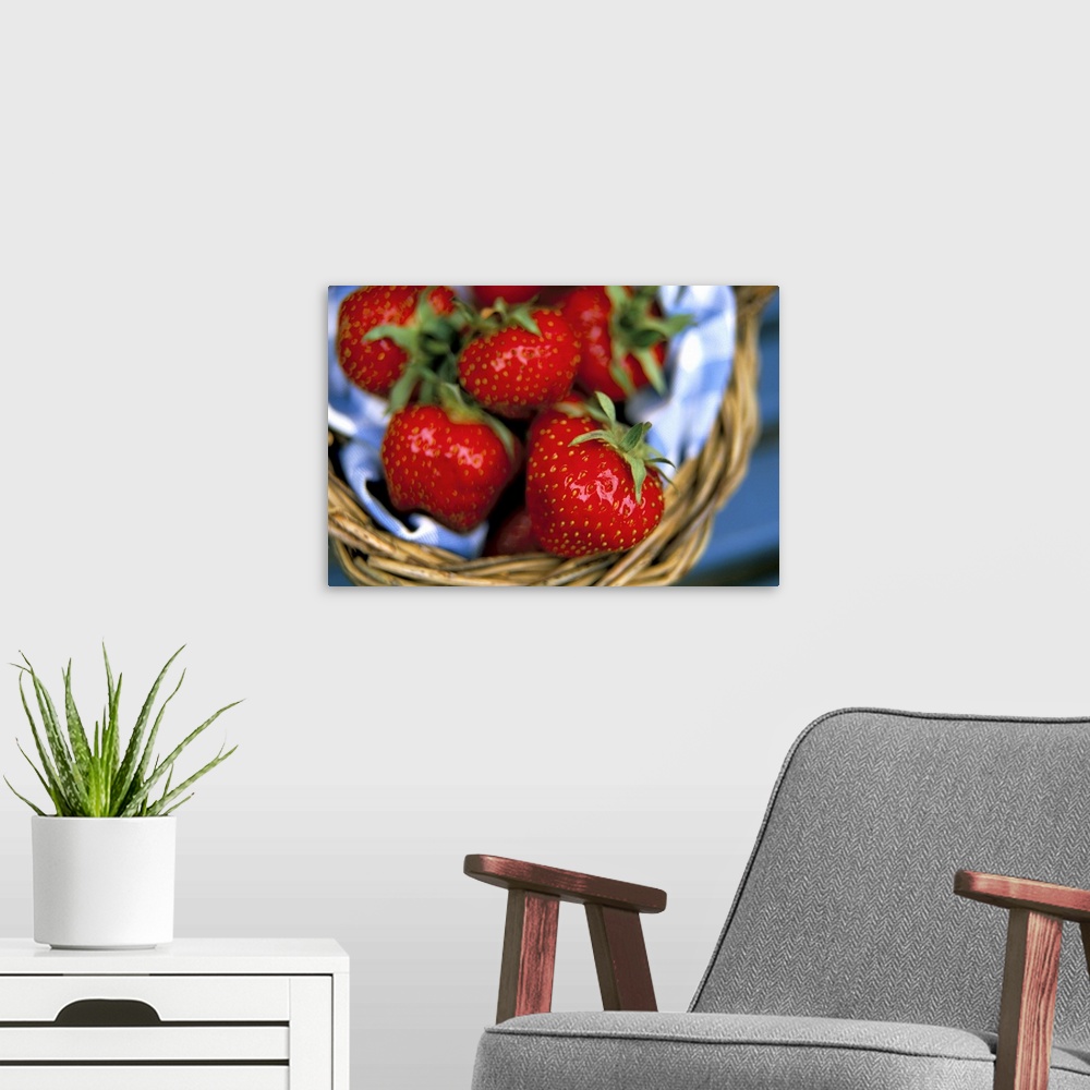 A modern room featuring Strawberries in a basket