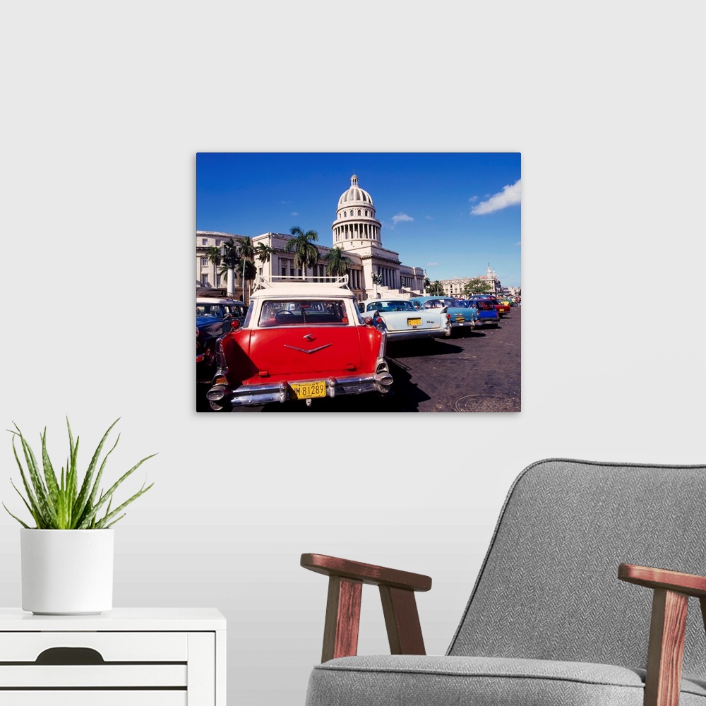 A modern room featuring Street scene of taxis parked near the Capitolio Building in Central Havana, Cuba