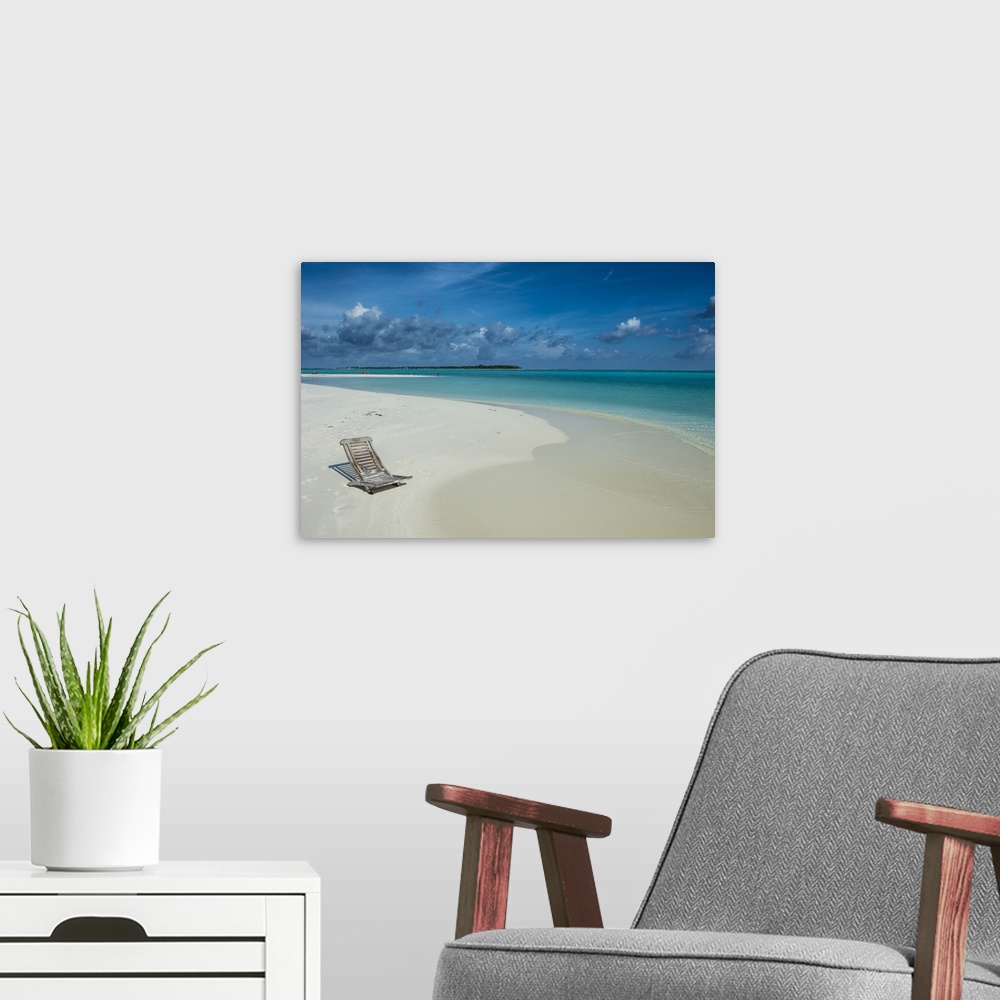 A modern room featuring Sun chair on a white sand beach and turquoise water, Sun Island Resort, Nalaguraidhoo island, Ari...