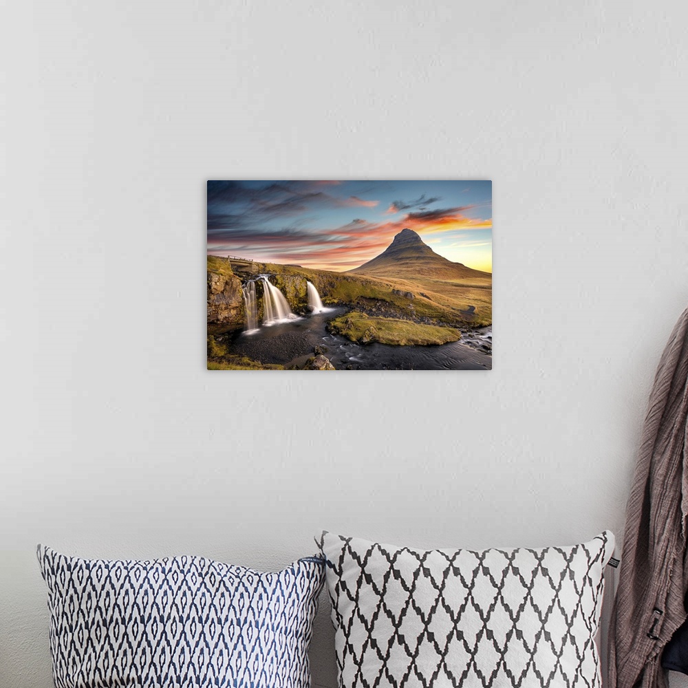 A bohemian room featuring Sunrise at Kirkjufell Mountain overlooking a small waterfall, Iceland, Polar Regions