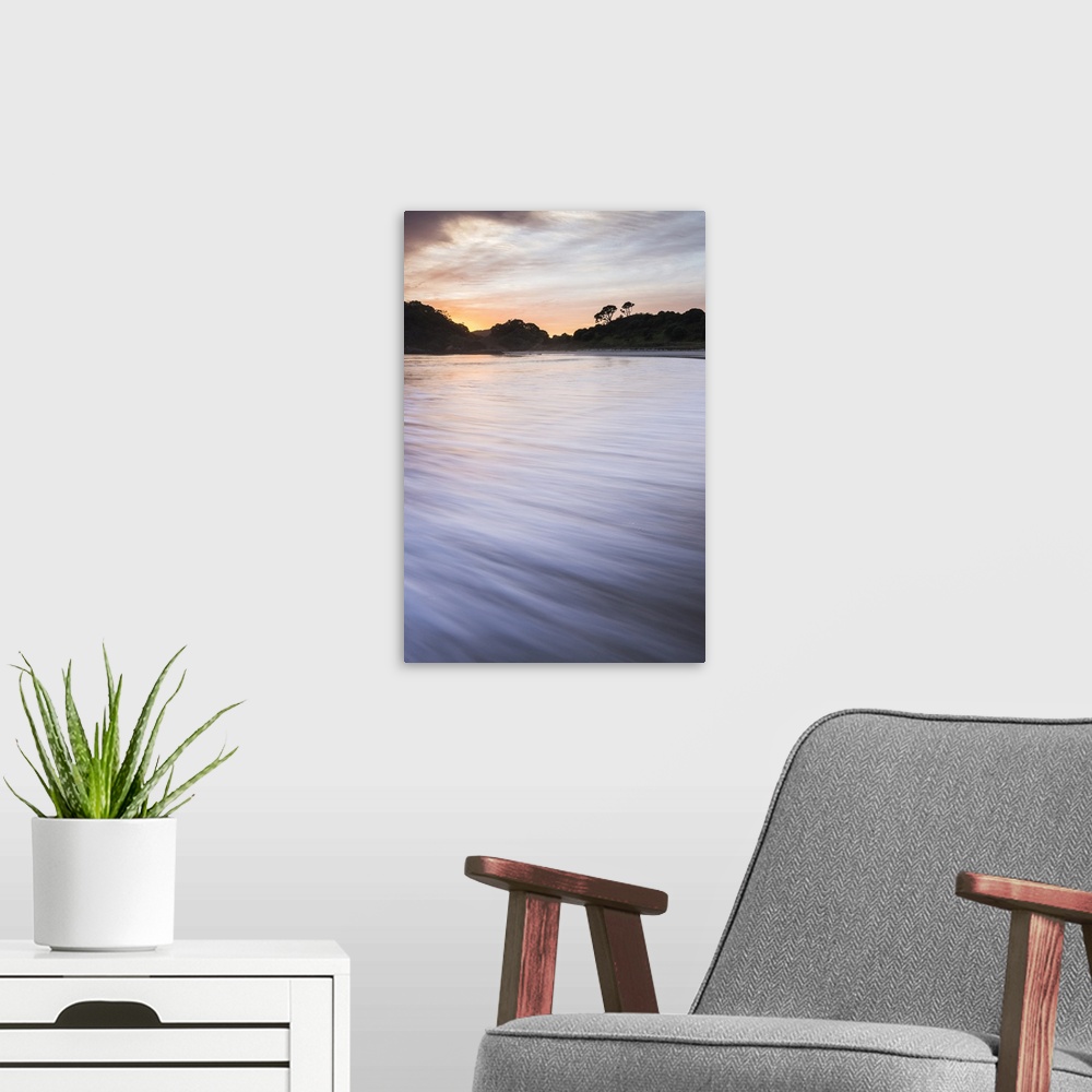 A modern room featuring Sunrise at Maitai Bay (Matai Bay), a popular beach on the Karikari Peninsula, Northland, New Zeal...