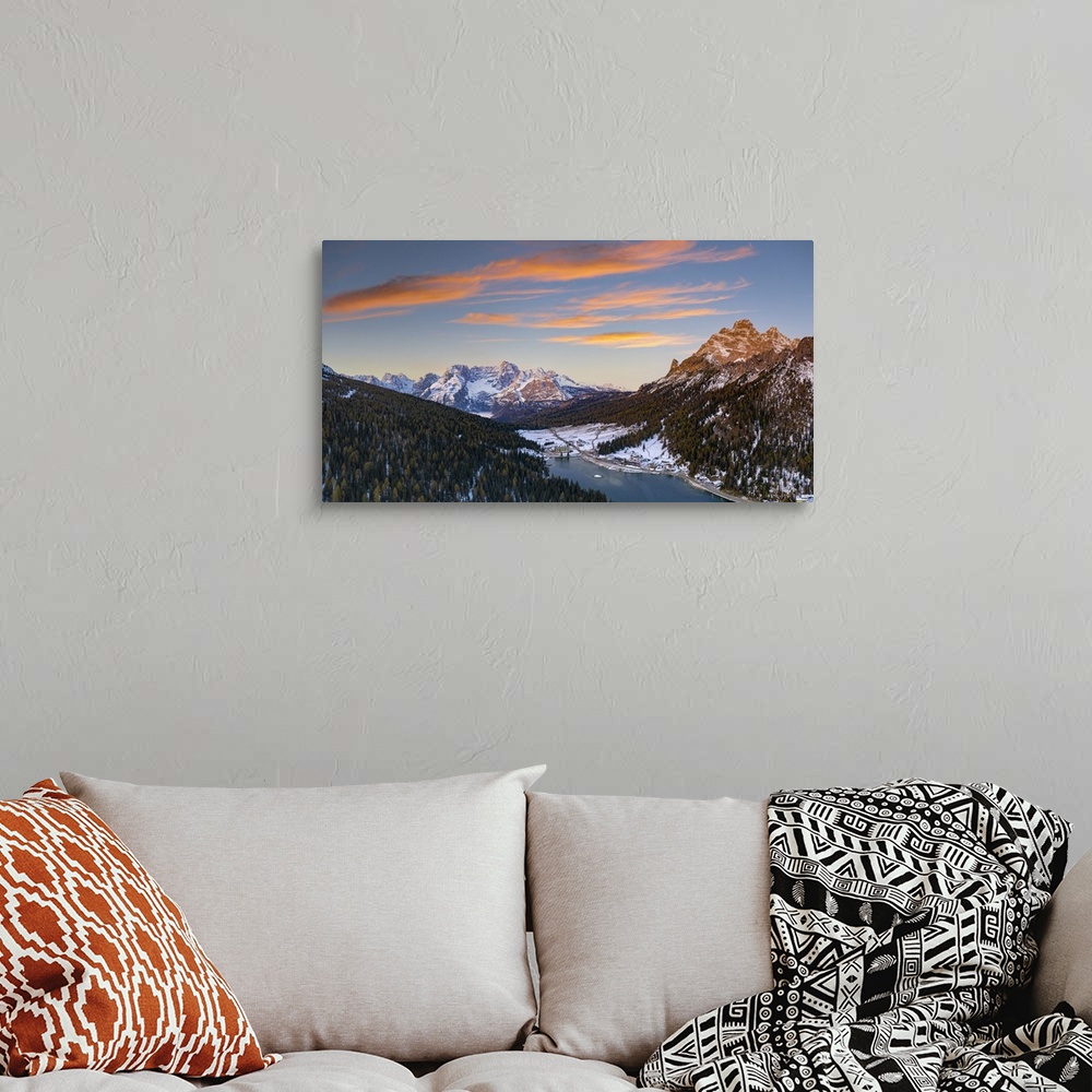 A bohemian room featuring Sunrise over the snowy woods surrounding Lake Misurina and Sorapis, aerial view, Dolomites, Bellu...