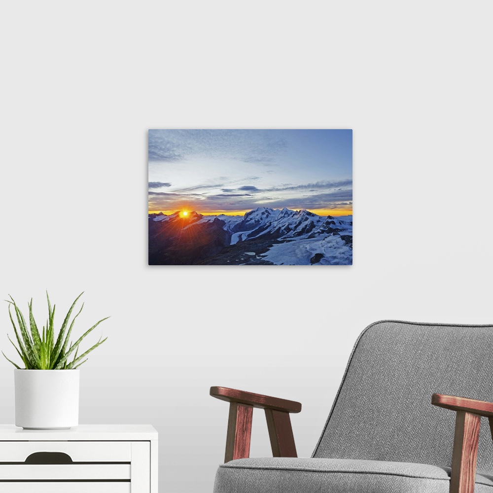 A modern room featuring Sunrise view of Monte Rosa from The Matterhorn, Zermatt, Valais, Swiss Alps, Switzerland, Europe.