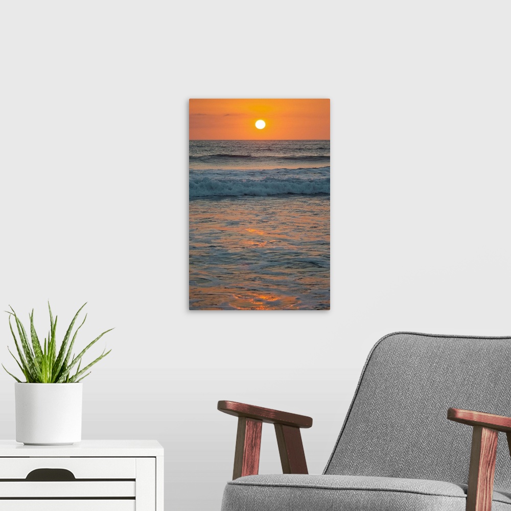 A modern room featuring Sunset at Playa Guiones surfing beach, Nosara, Nicoya Peninsula, Guanacaste Province, Pacific coa...