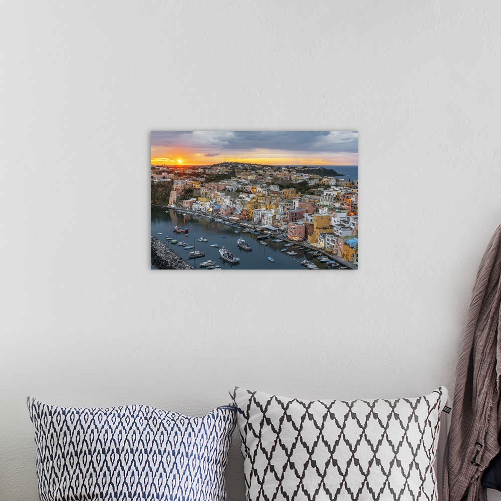 A bohemian room featuring Sunset on Marina Corricella, the famous colourful fishing village on Procida island, Tyrrhenian S...