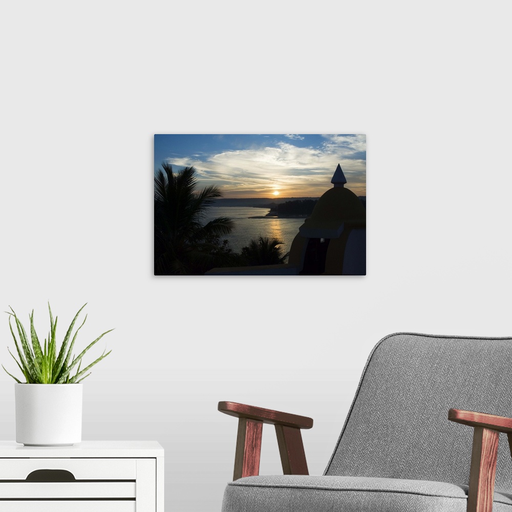 A modern room featuring Sunset over the Tiracol River  viewed from Fort Tiiracol, Goa, India