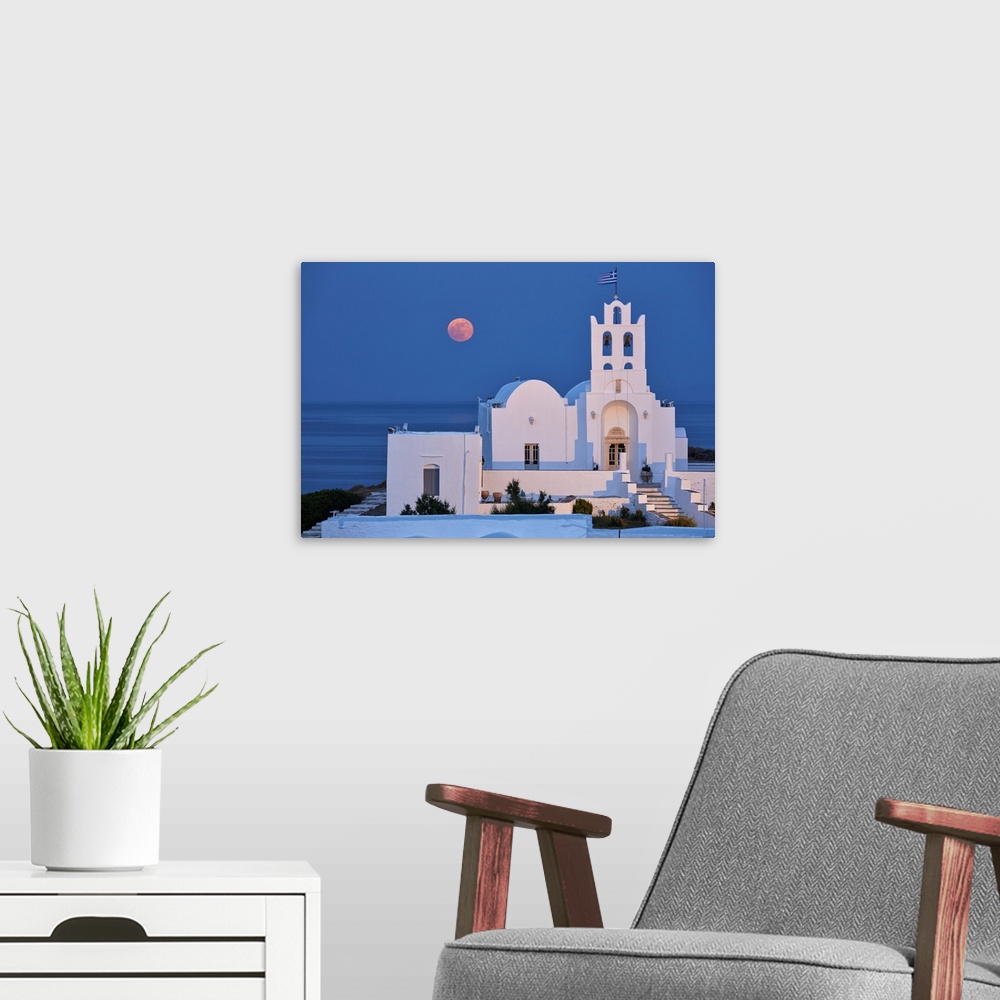 A modern room featuring Super moon rising behind Chrisopigi Monastery on Sifnos island at dusk, Cyclades, Greek Islands, ...