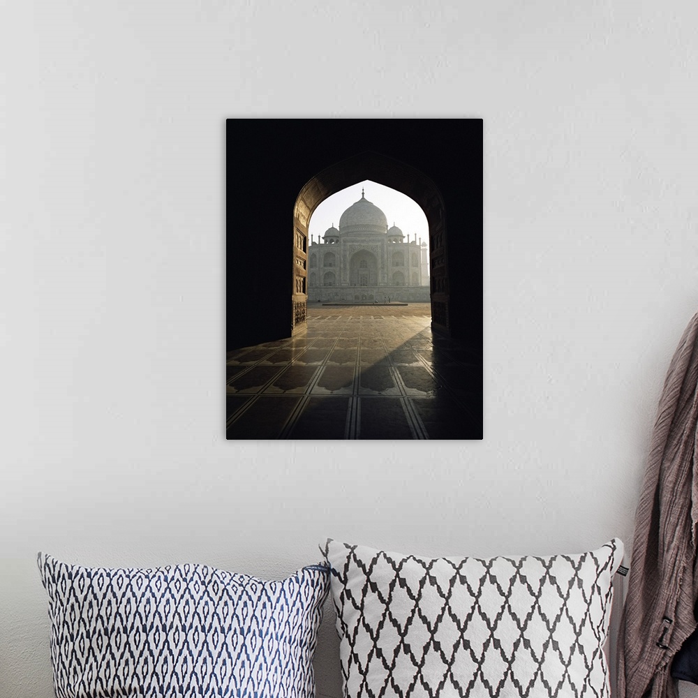 A bohemian room featuring Taj Mahal, seen through gateway, Agra, Uttar Pradesh state, India