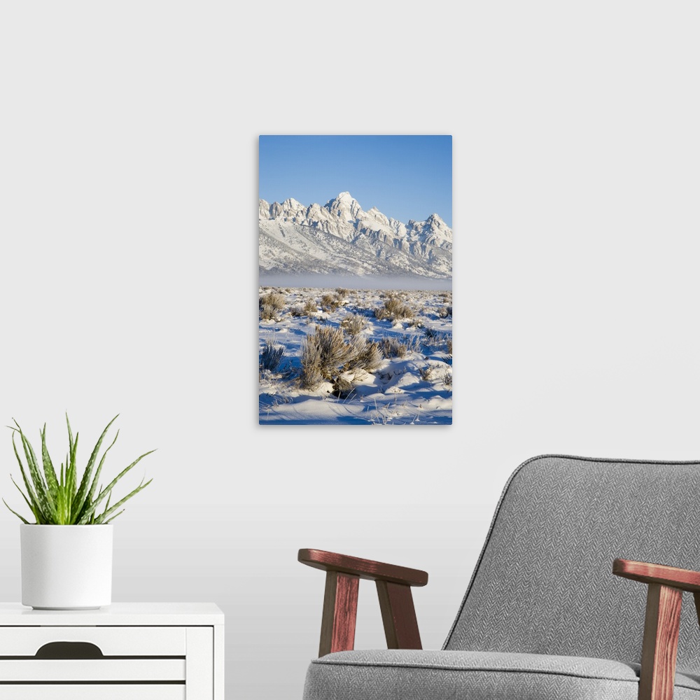 A modern room featuring Tetons with first light in the valley with snow, Grand Teton National Park, Wyoming