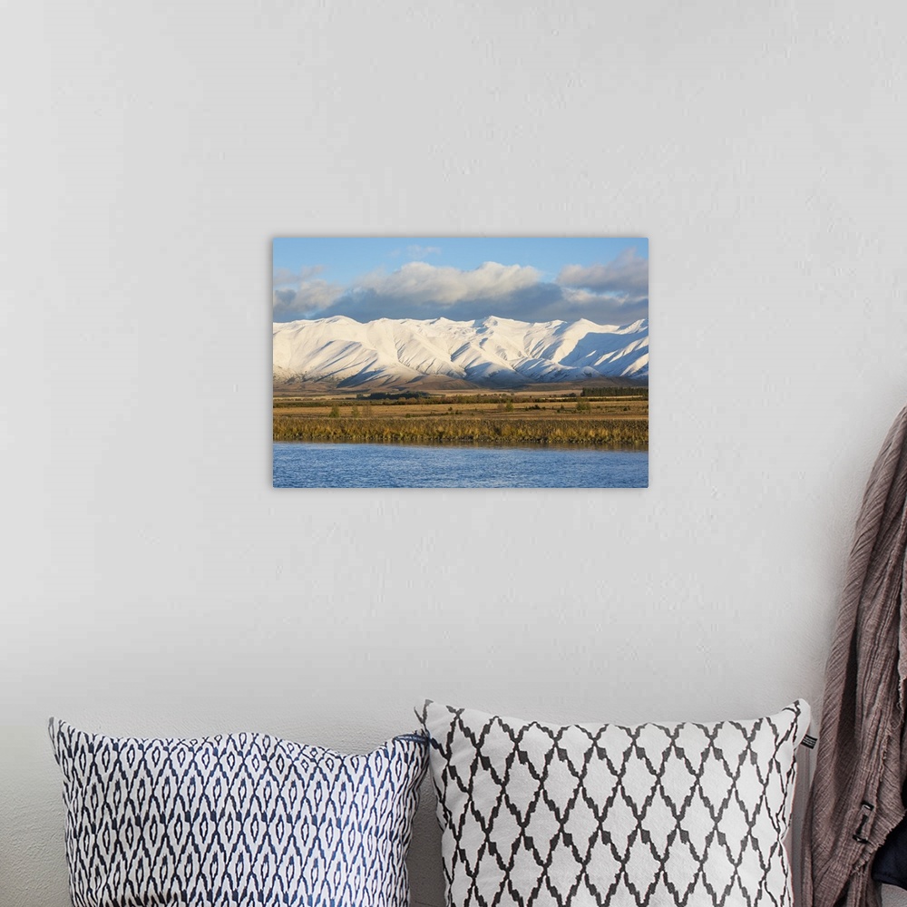 A bohemian room featuring The Ben Ohau Range cloaked in autumn snow, the Pukaki Canal in foreground, Twizel, Mackenzie dist...