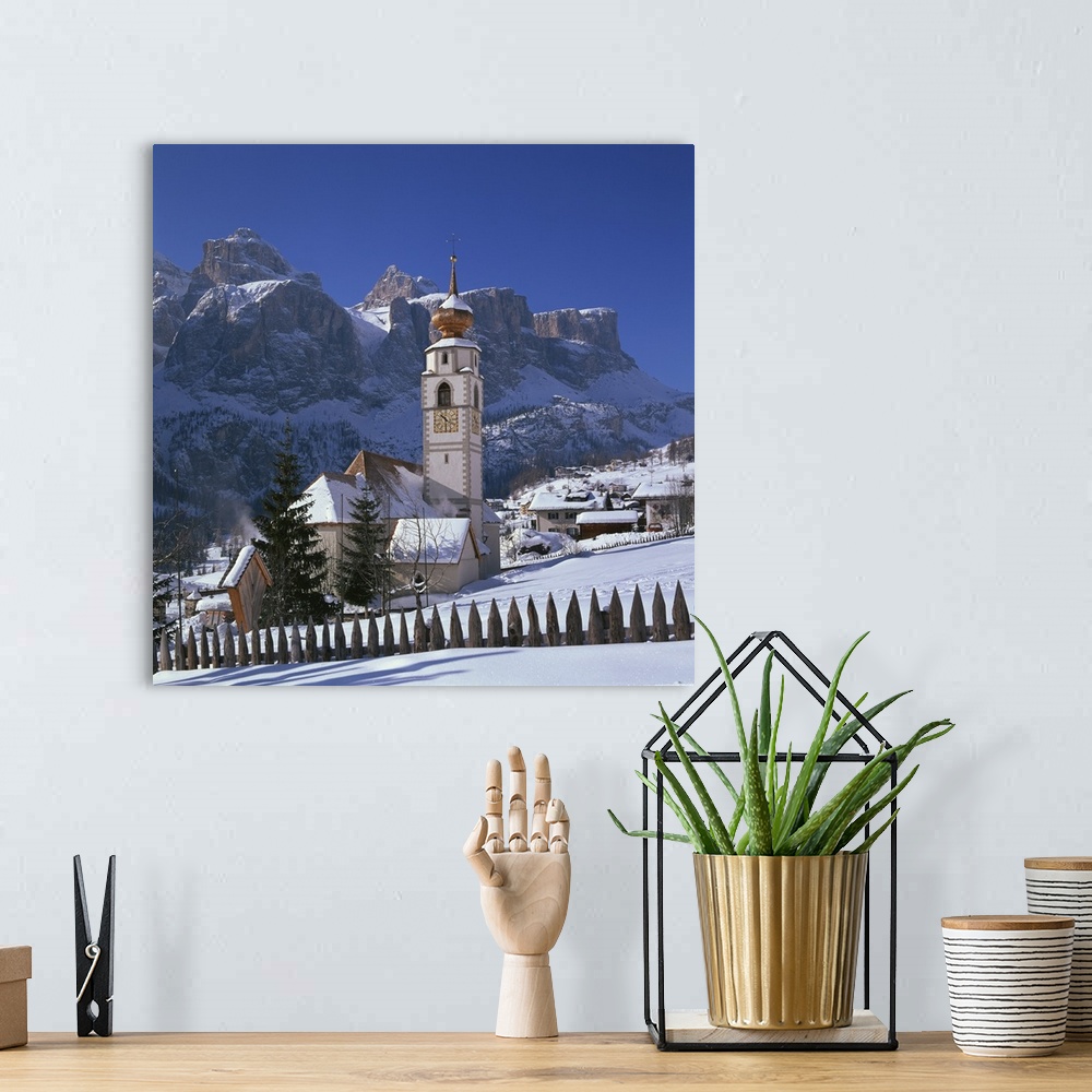 A bohemian room featuring The church and village of Colfosco in Badia, Trentino Alto Adige, Italy