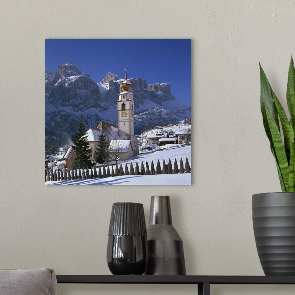 A modern room featuring The church and village of Colfosco in Badia, Trentino Alto Adige, Italy
