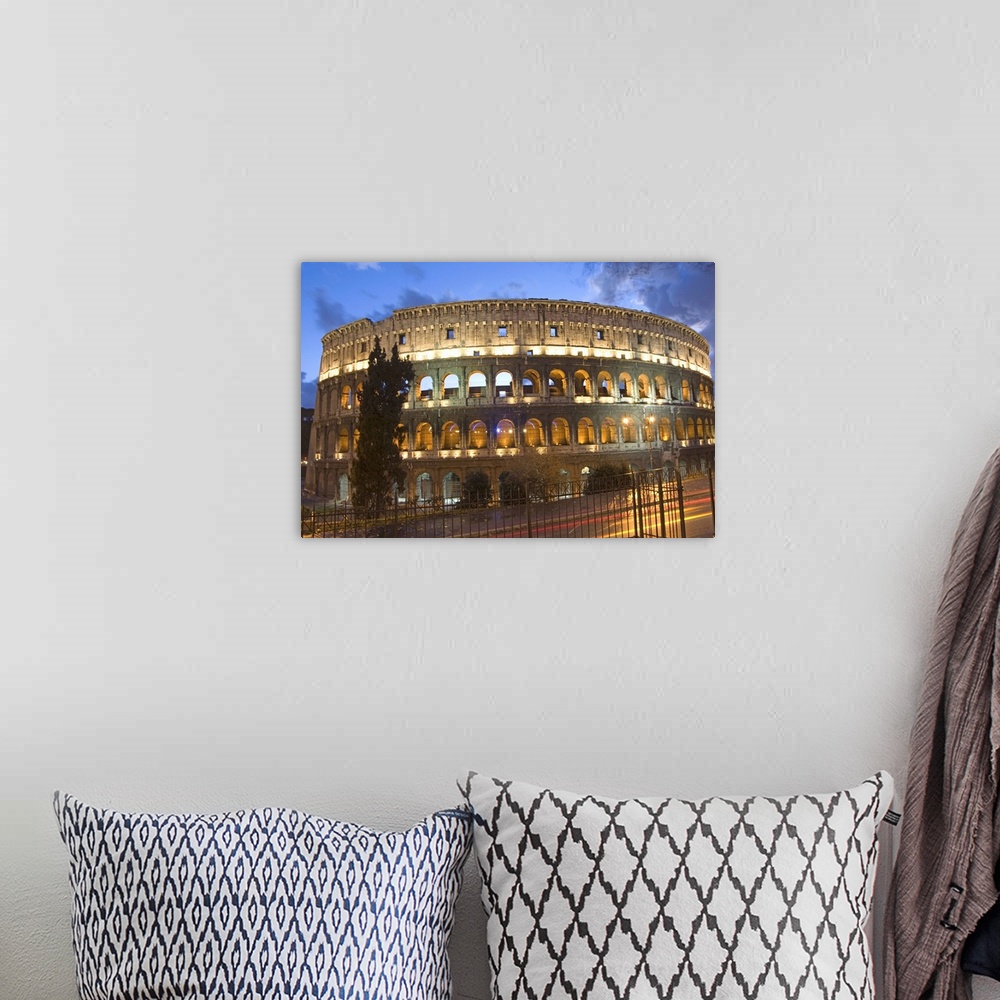A bohemian room featuring The Colosseum at night with traffic trails, Rome, Lazio, Italy