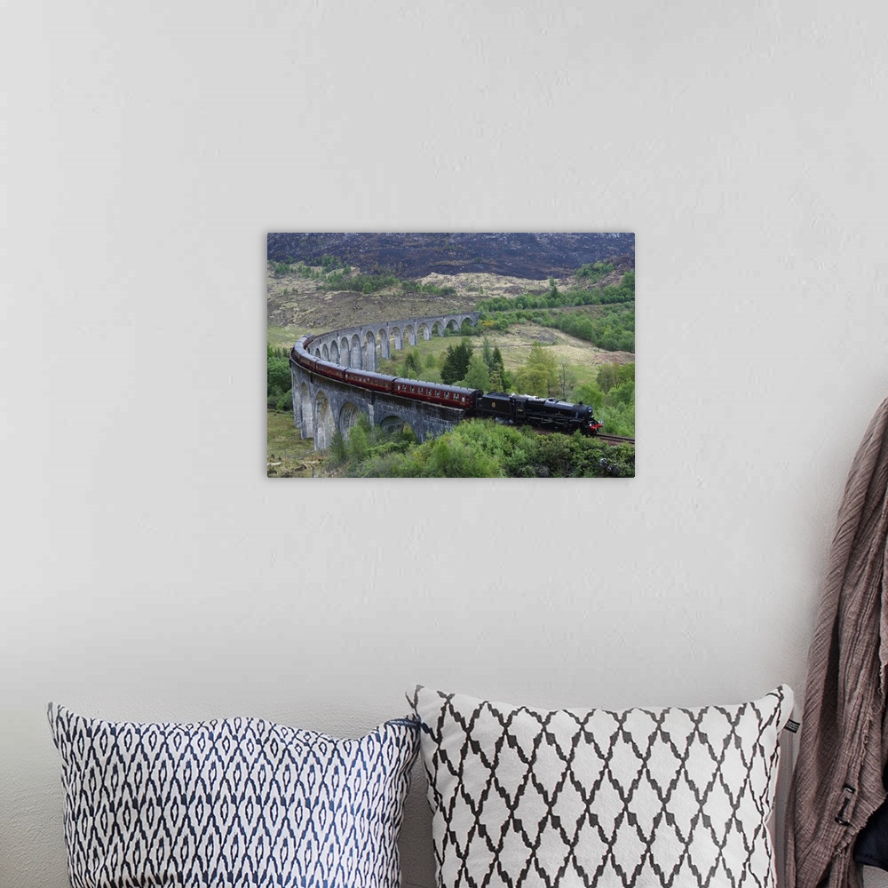 A bohemian room featuring The Jacobite Express crossing Glenfinnan Viaduct, Mallaig, Highlands, Scotland, United Kingdom, E...