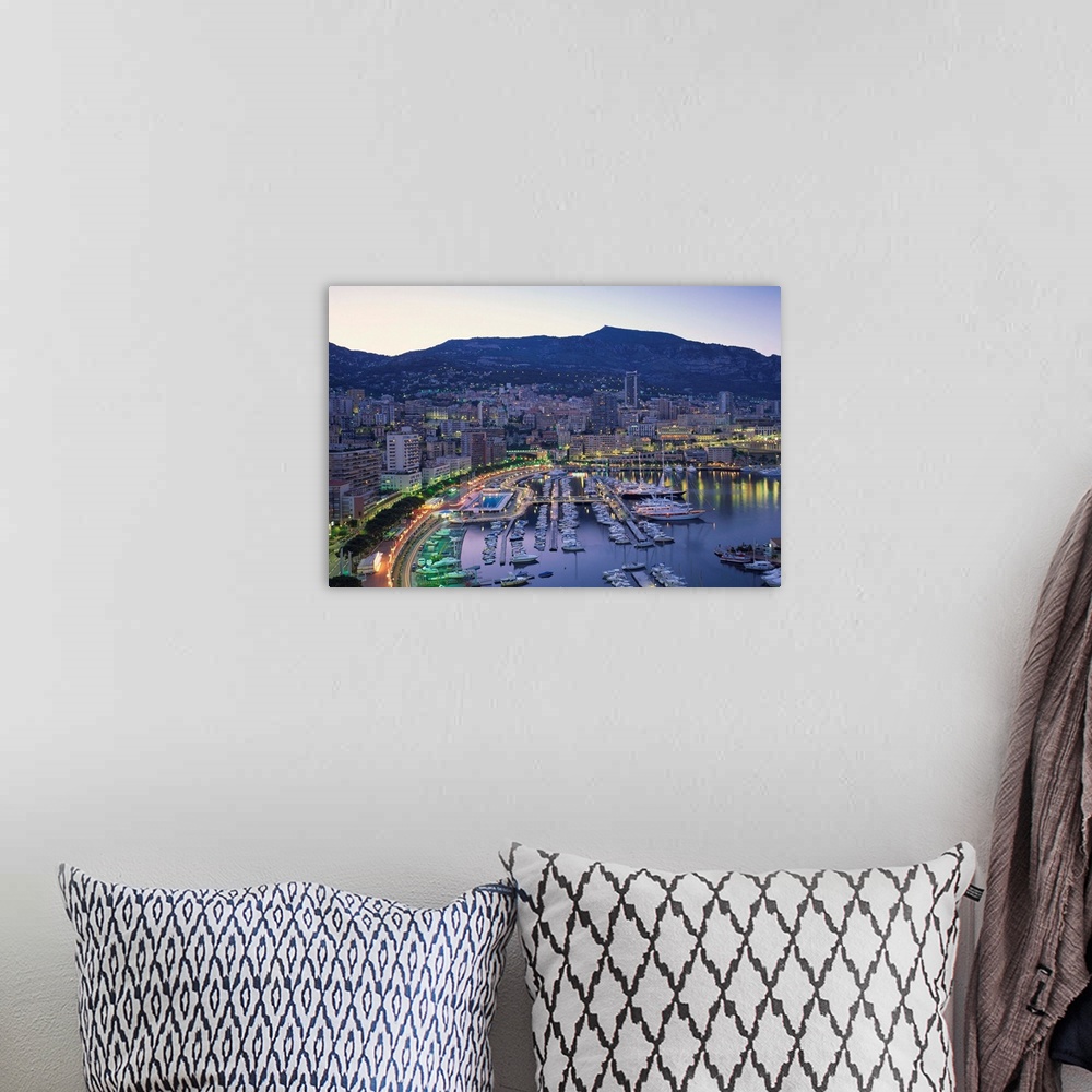A bohemian room featuring The marina, waterfront and town of Monte Carlo in the evening, Monaco