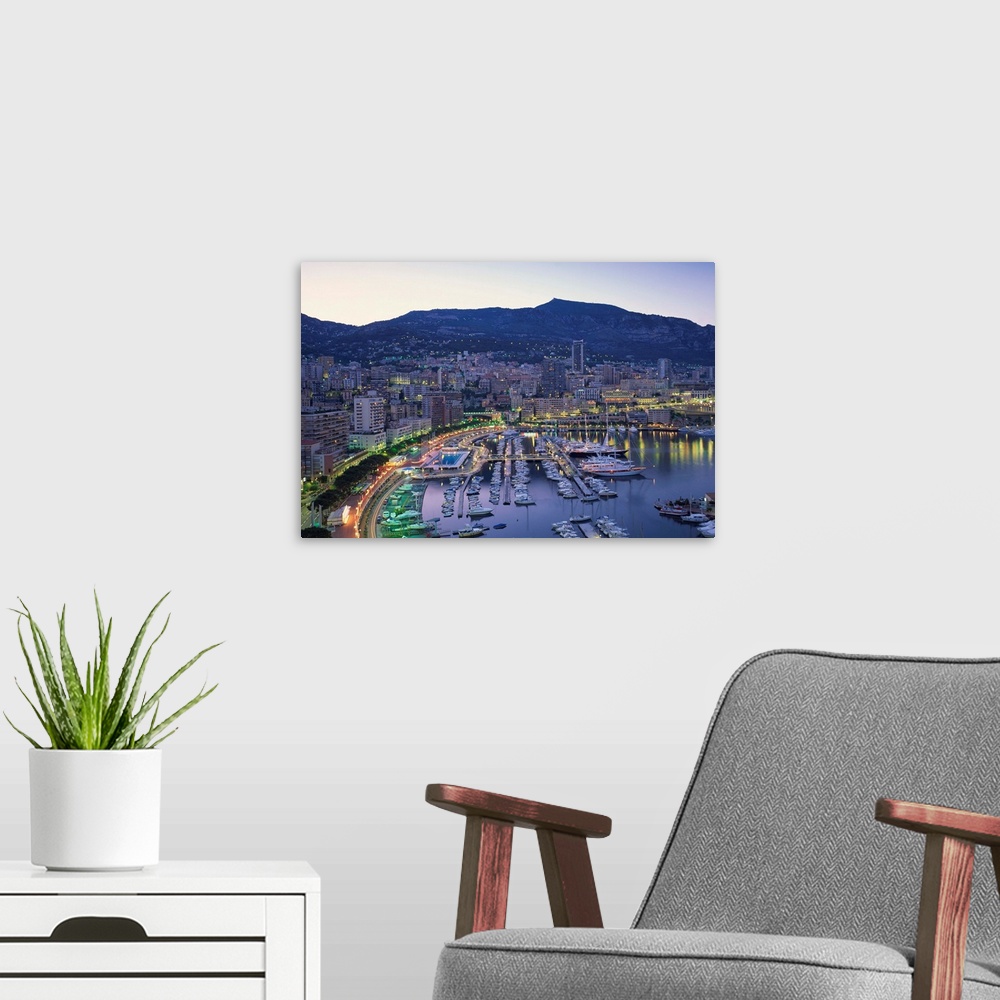 A modern room featuring The marina, waterfront and town of Monte Carlo in the evening, Monaco
