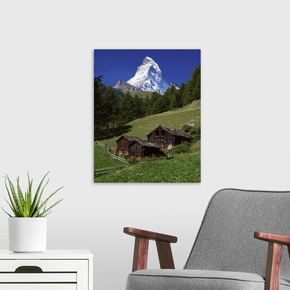 A modern room featuring The Matterhorn towering above green pastures, Zermatt, Valais, Switzerland
