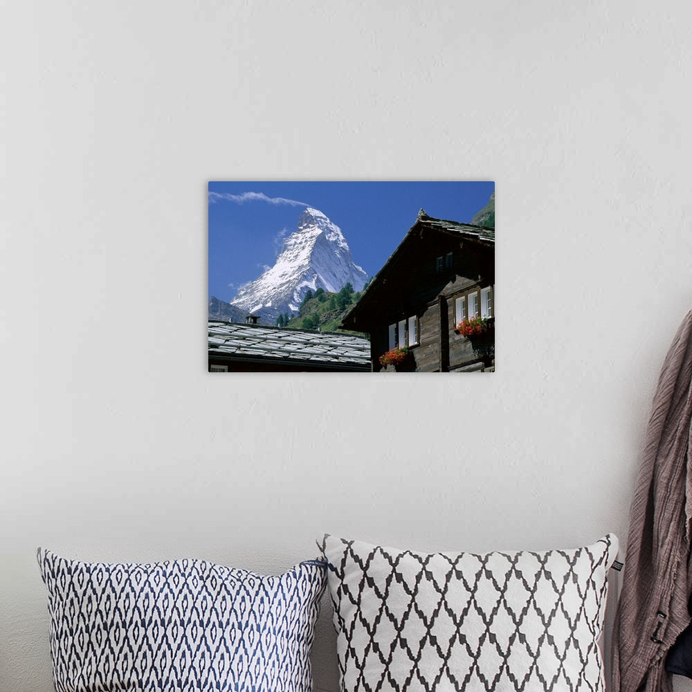 A bohemian room featuring The peak of the Matterhorn mountain towering above chalet rooftops, Zermatt, Valais, Swiss Alps, ...