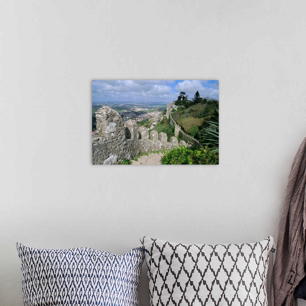 A bohemian room featuring The ramparts of the Moorish Castelo dos Mouros, captured by Christians in 1147, above the town of...