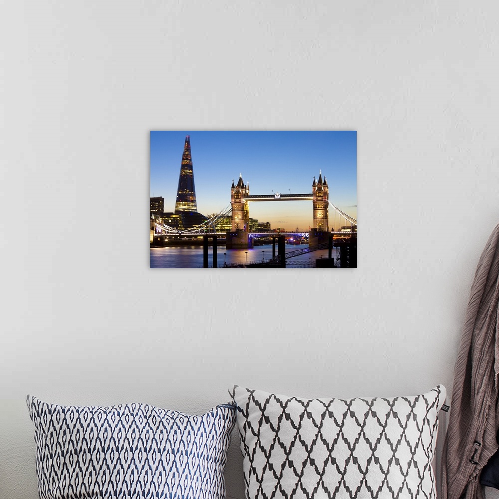 A bohemian room featuring The Shard and Tower Bridge at night, London, England, UK