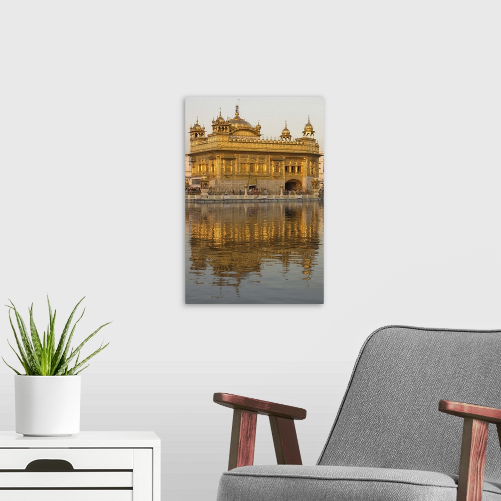 A modern room featuring The Sikh Golden Temple reflected in pool, Amritsar, Punjab state, India, Asia