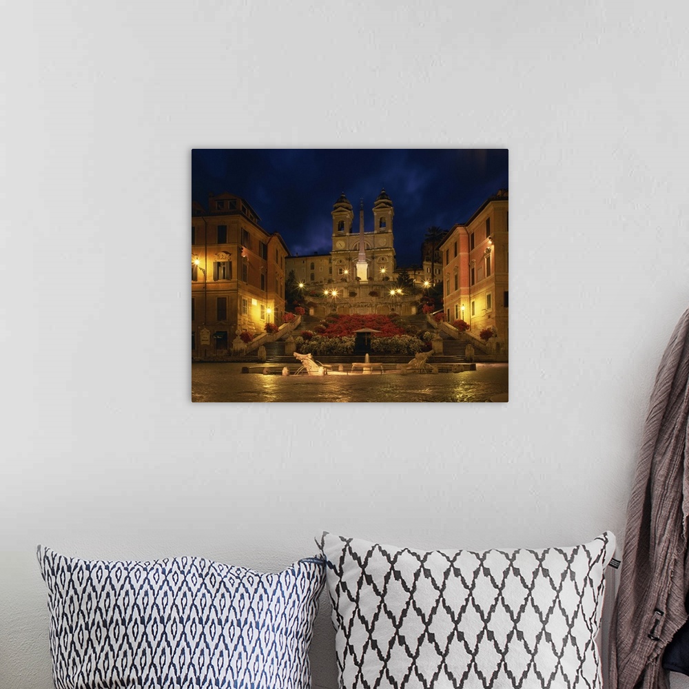 A bohemian room featuring The Spanish Steps illuminated at night in the city of Rome, Lazio, Italy