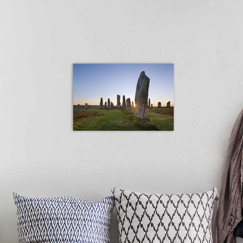 A bohemian room featuring The sun rises at Callanish stone circle, Isle of Lewis, Outer Hebrides, Scotland, United Kingdom,...