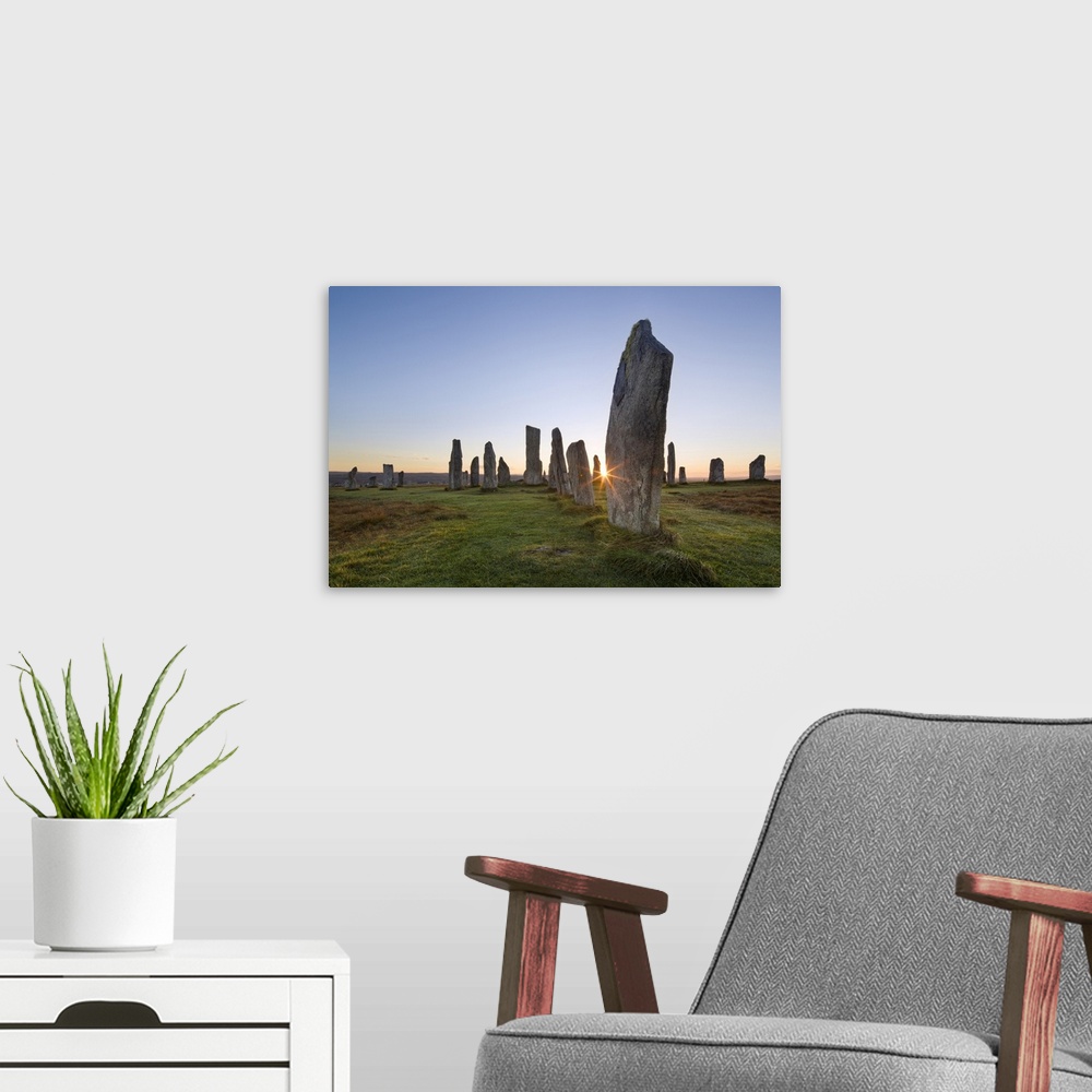 A modern room featuring The sun rises at Callanish stone circle, Isle of Lewis, Outer Hebrides, Scotland, United Kingdom,...